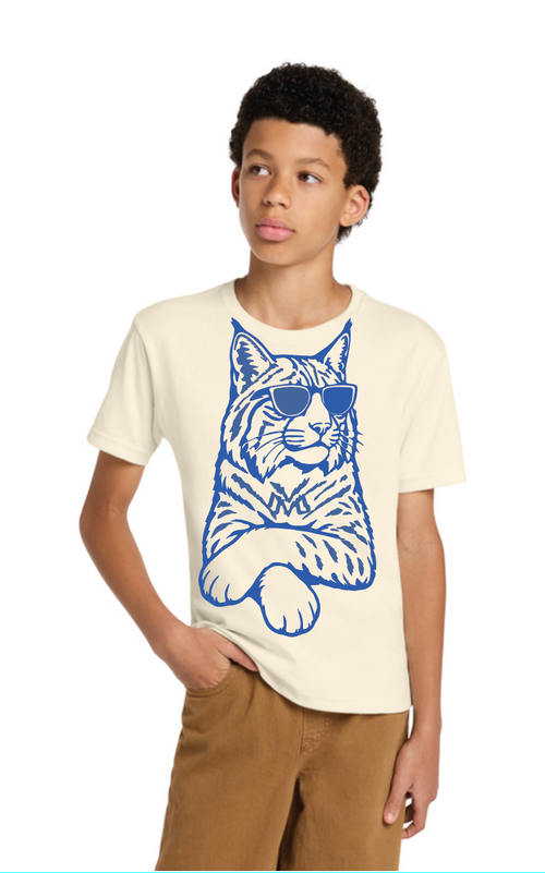Youth model wearing an ivory Cool Cat T-shirt with a blue cat graphic wearing sunglasses